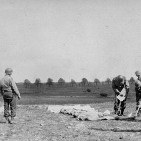 American soldiers mark graves of dead prisons from Ohrdruf concentration camp.