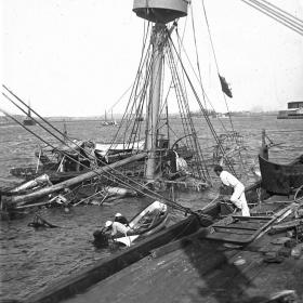 Photograph of the remains of USS Maine after being sunk in Havana Harbor.