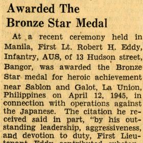 Newspaper article about Robert Eddy receiving the Bronze Star Medal