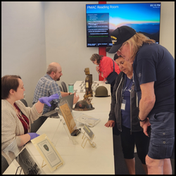people looking at artifacts