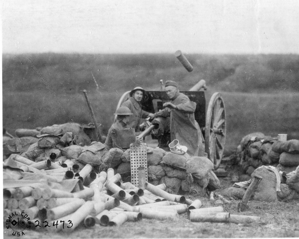 Soldiers firing a French 75mm howizer.