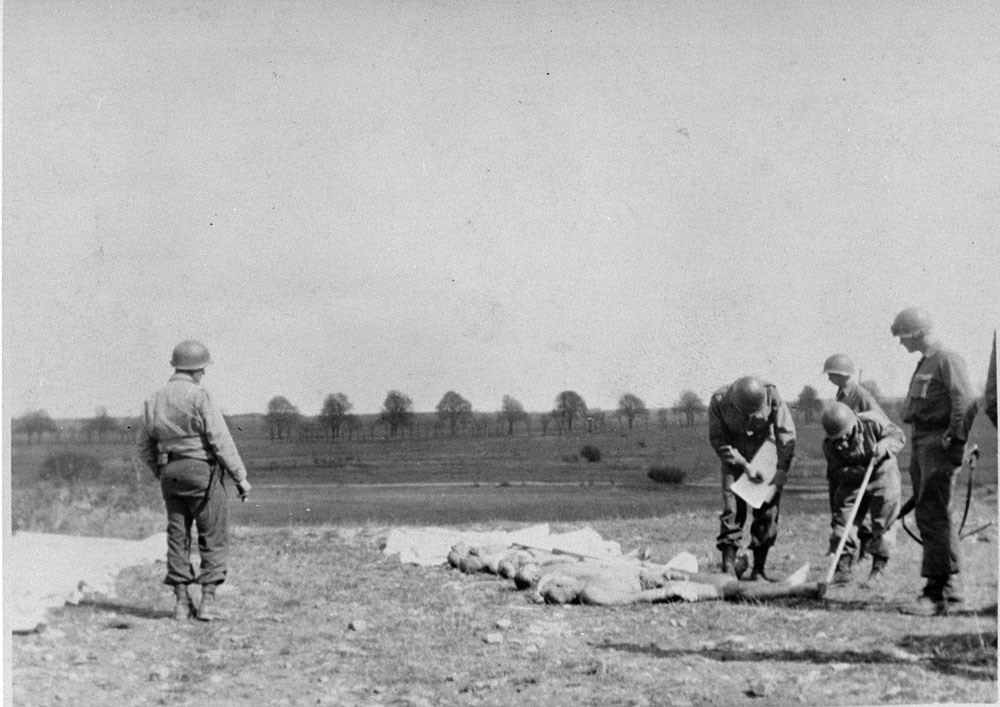 American soldiers mark graves of dead prisons from Ohrdruf concentration camp.