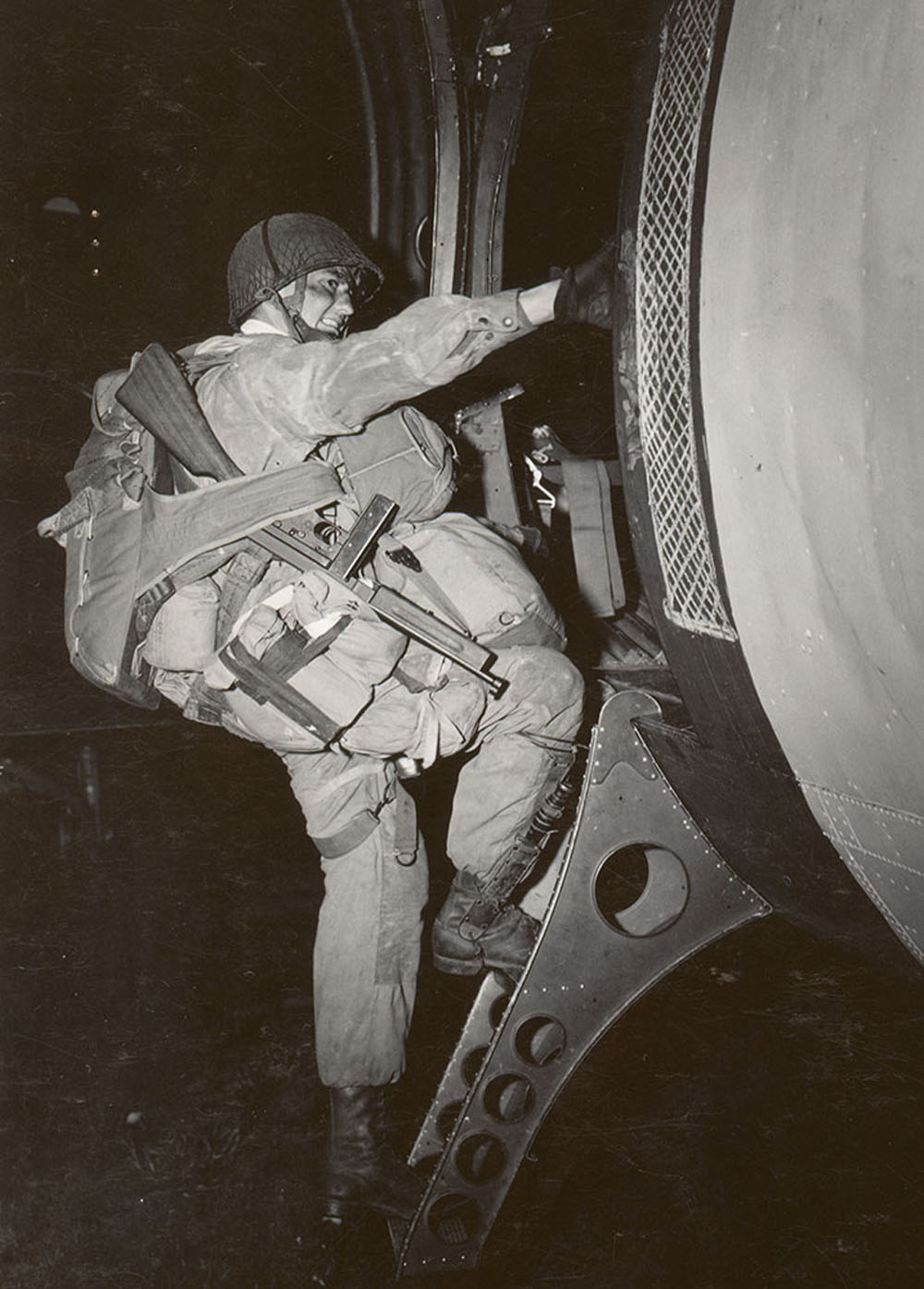 Joseph F Gorence of the 101st Airborne Division boards a C-47