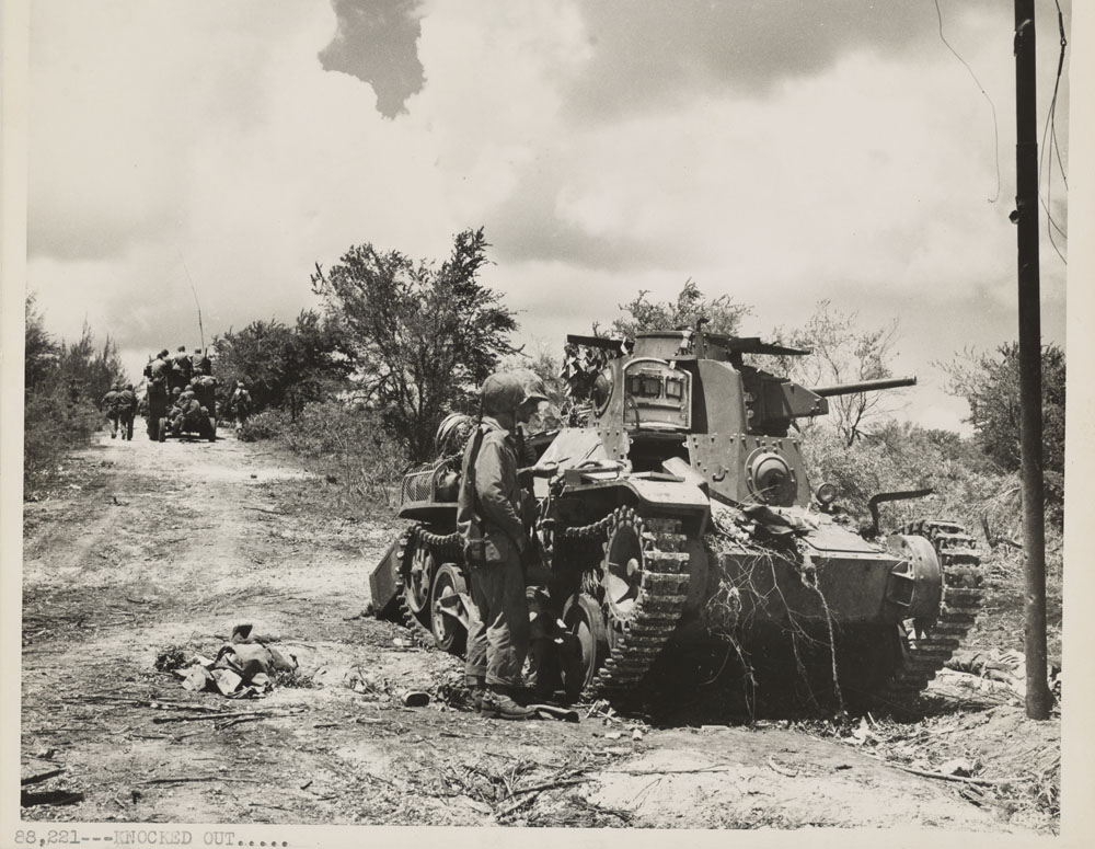 U.S. troops on Tinian advance towards the enemy.