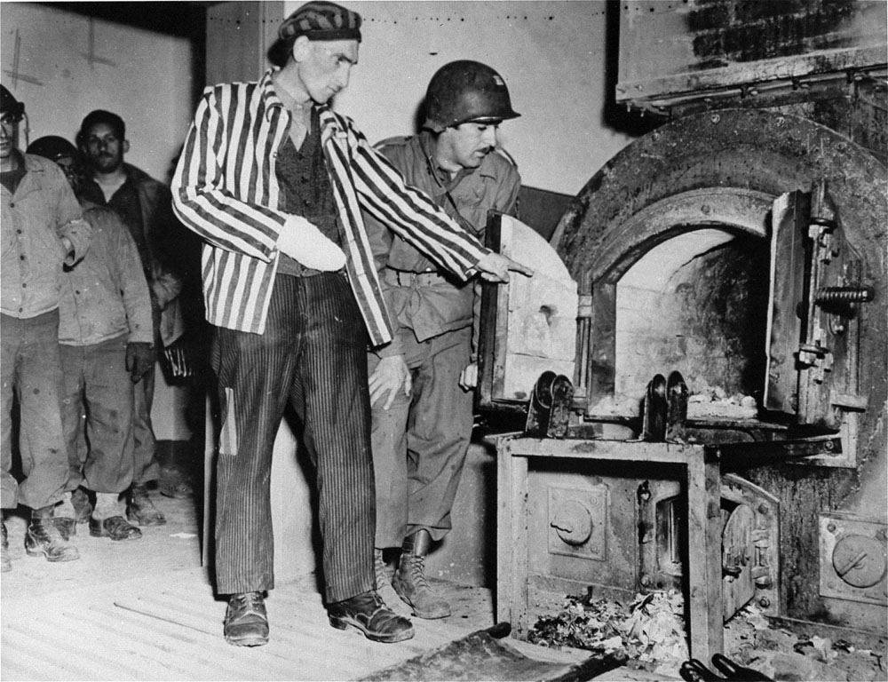 Dora-Mittelbau camp survivor shows solder John L Lyndon the crematorium ovens.
