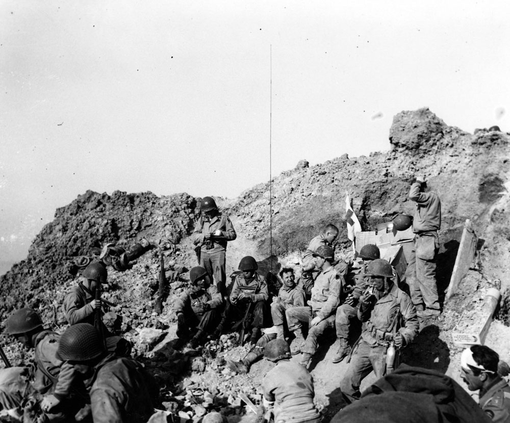 U.S. Army Rangers rest atop the cliffs at Pointe du Hoc, which they stormed in support of Omaha Beach landings on D-Day, 6 June 1944.