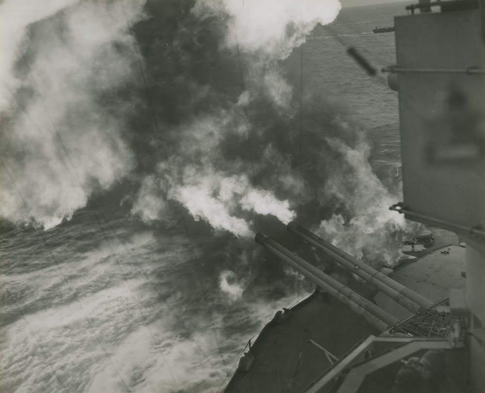 U.S.S. Nevada pours an obliterating hail of death on Nazi positions blocking the forward surge of Allied troops in France.