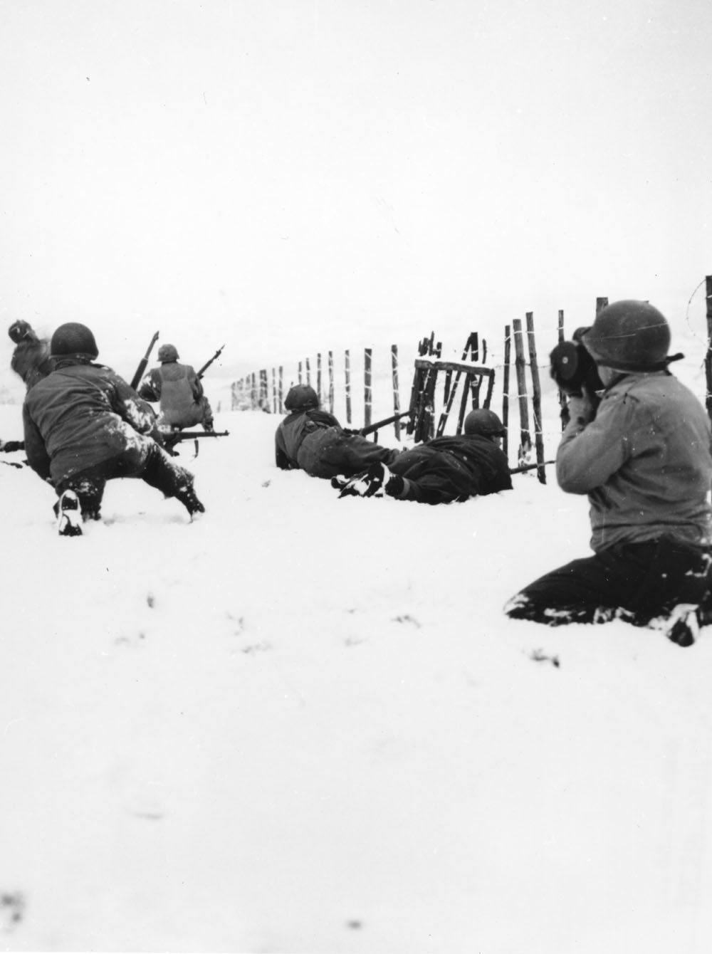 American soldiers patrol outside of Beffe, Belgium