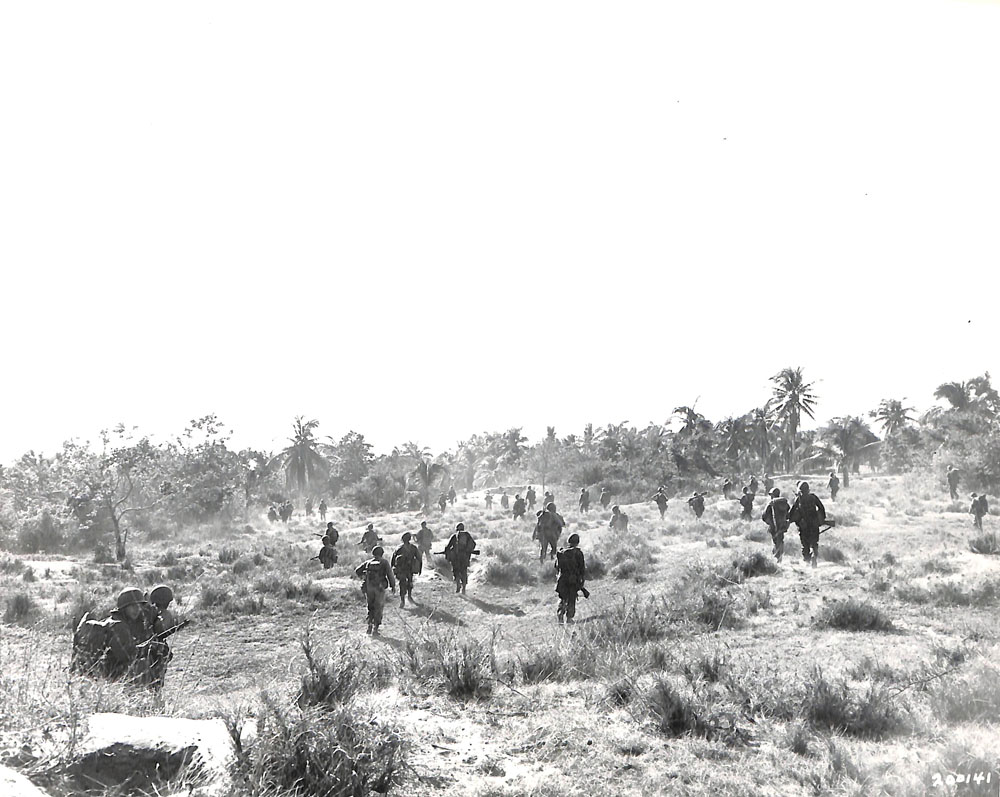 American troops moving inland on Luzon, Philippines.