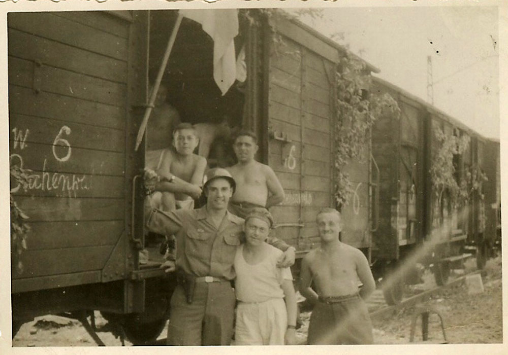 Lothar Kahn stands with Buchenwald concentration camp survivors, on their way to displaced persons camp.