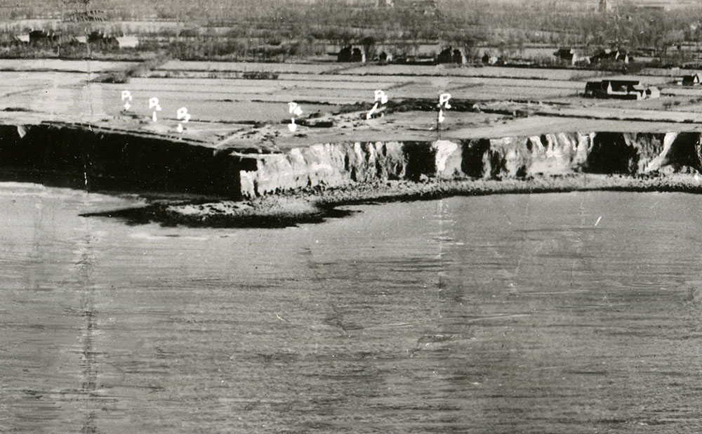 Allied commanders utilized annotated reconnaissance photos to determine the positions of German artillery at Pointe du Hoc.