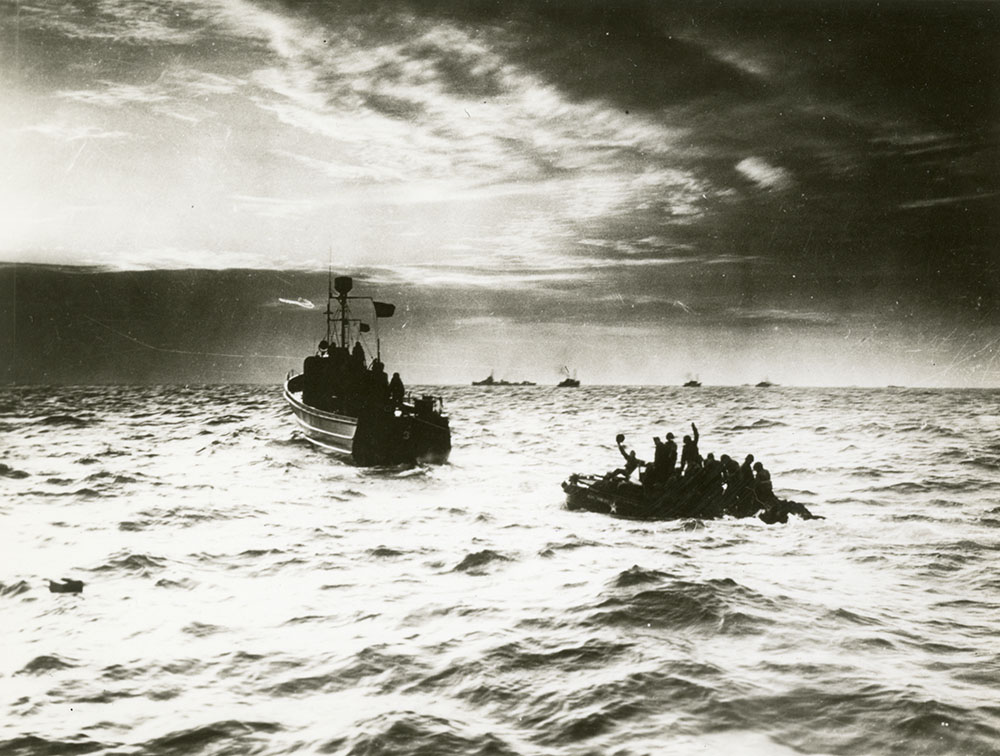 American soldiers on sinking landing barge saved by Coast Guard.