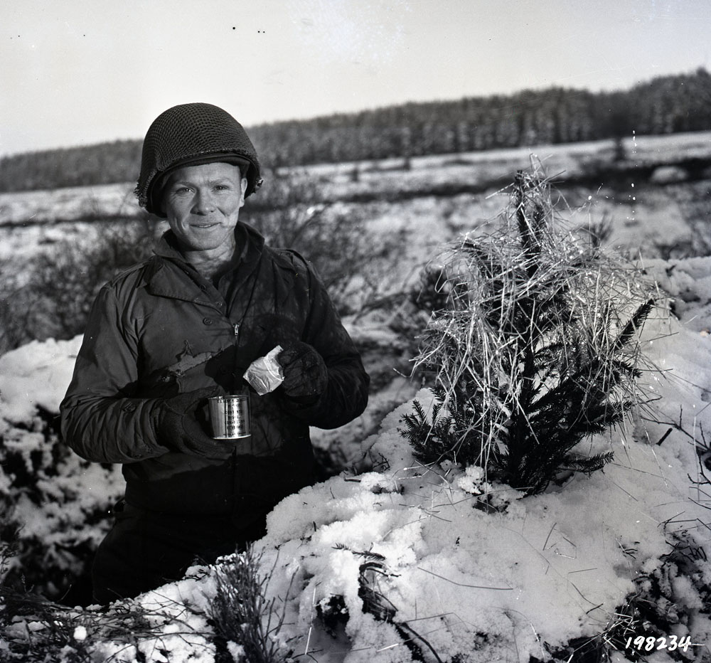 Ssgt O'Brien standing in a foxhole in Monschau, Germany.