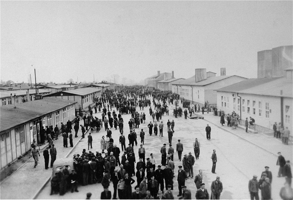Liberated survivors walk the Main Street at Mauthausen Concentration Camp