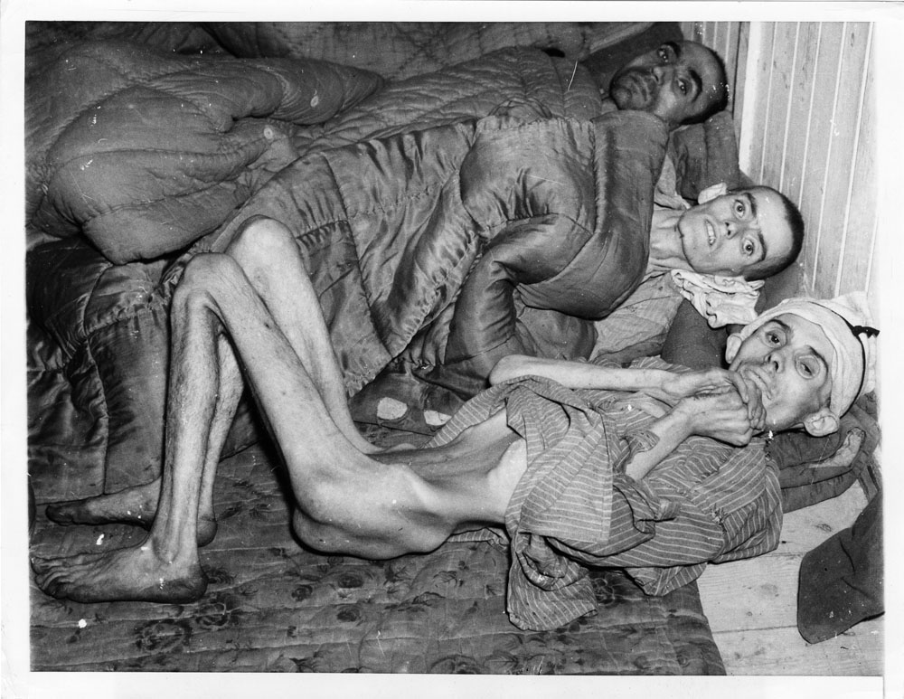 Emaciated survivors from Buchenwald concentration camp.