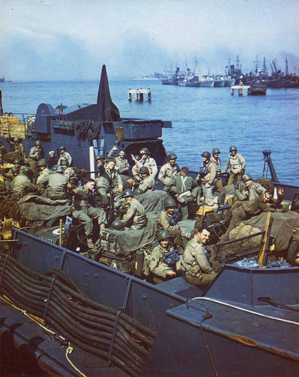 One of the many types of vessels used to transport American soldiers was a Landing Craft, Tank (LCT), shown here with soldiers packed in among vehicles and supplies.