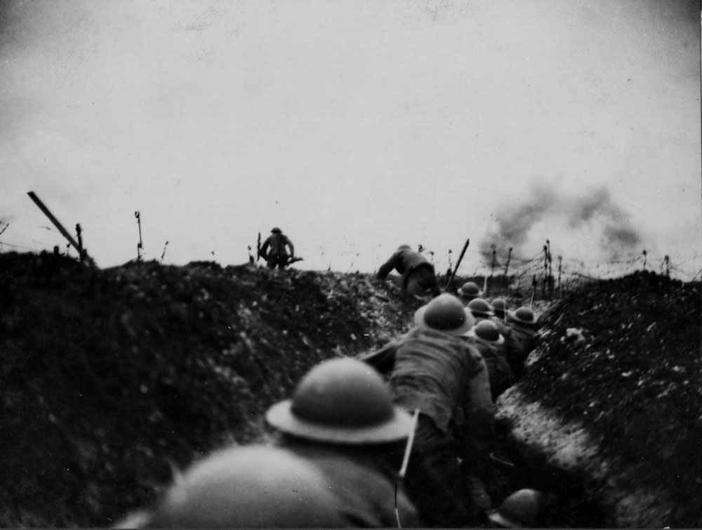 An officer leads the way over the top, April 7, 1918.