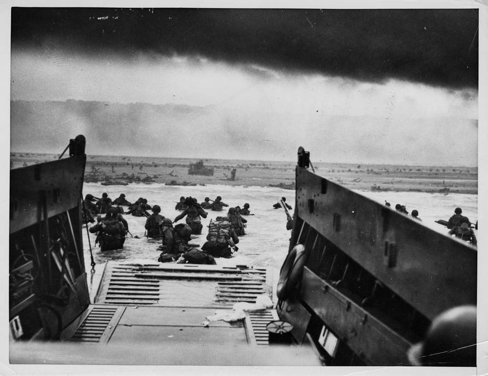 GI's landing in France from Coast Guard landing barge on June 6, 1944.