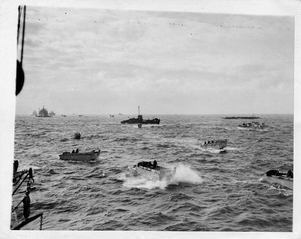 Landing craft of all types head through a choppy sea for the invasion beachhead along the coast of Normandy, during the early hours of the Allied landings.