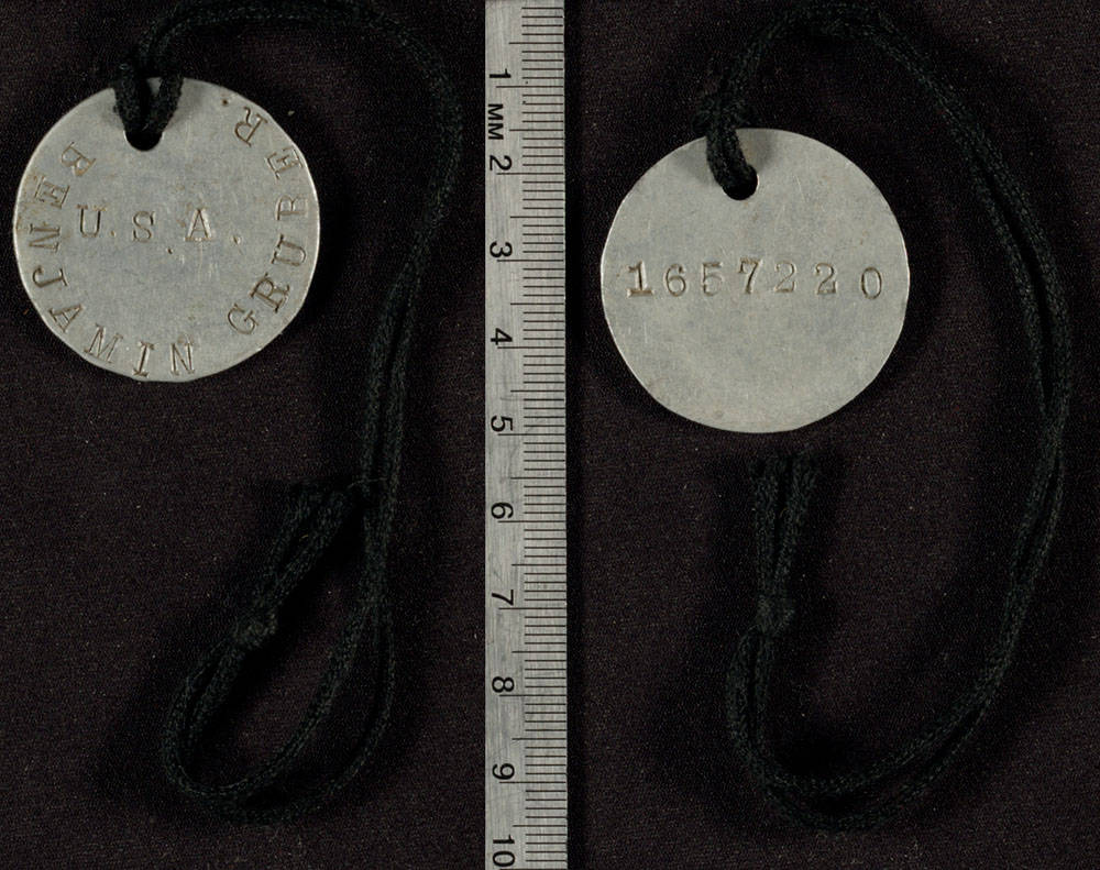 This identification tag has the inscription "James L. Davis PFC USA" and "1297407".