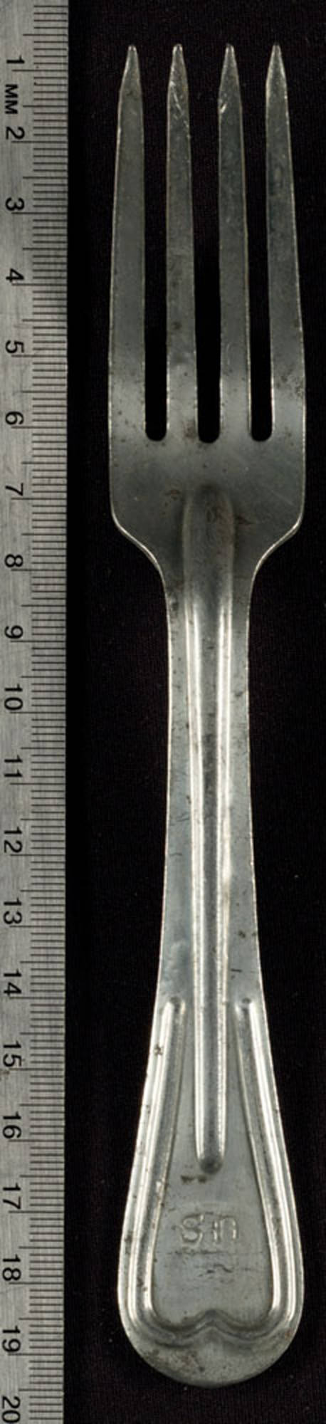 Metal fork has "US" stamped onto the top of the handle. On the reverse side is "WBW," the number "4134," and "1918."