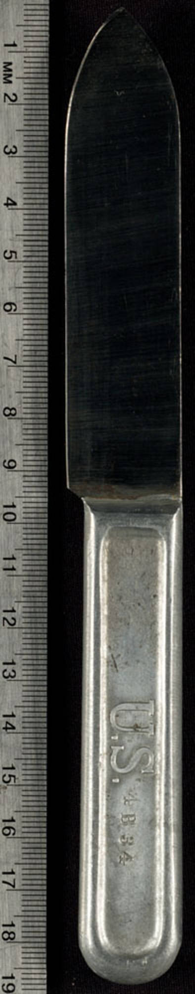 Metal knife has "US" and "4B34" stamped onto the top of the handle. On the reverse side are "A.C. Co." and "1917" which indicate the manufacturer, American Cutlery Company and the manufacture date, 1917.