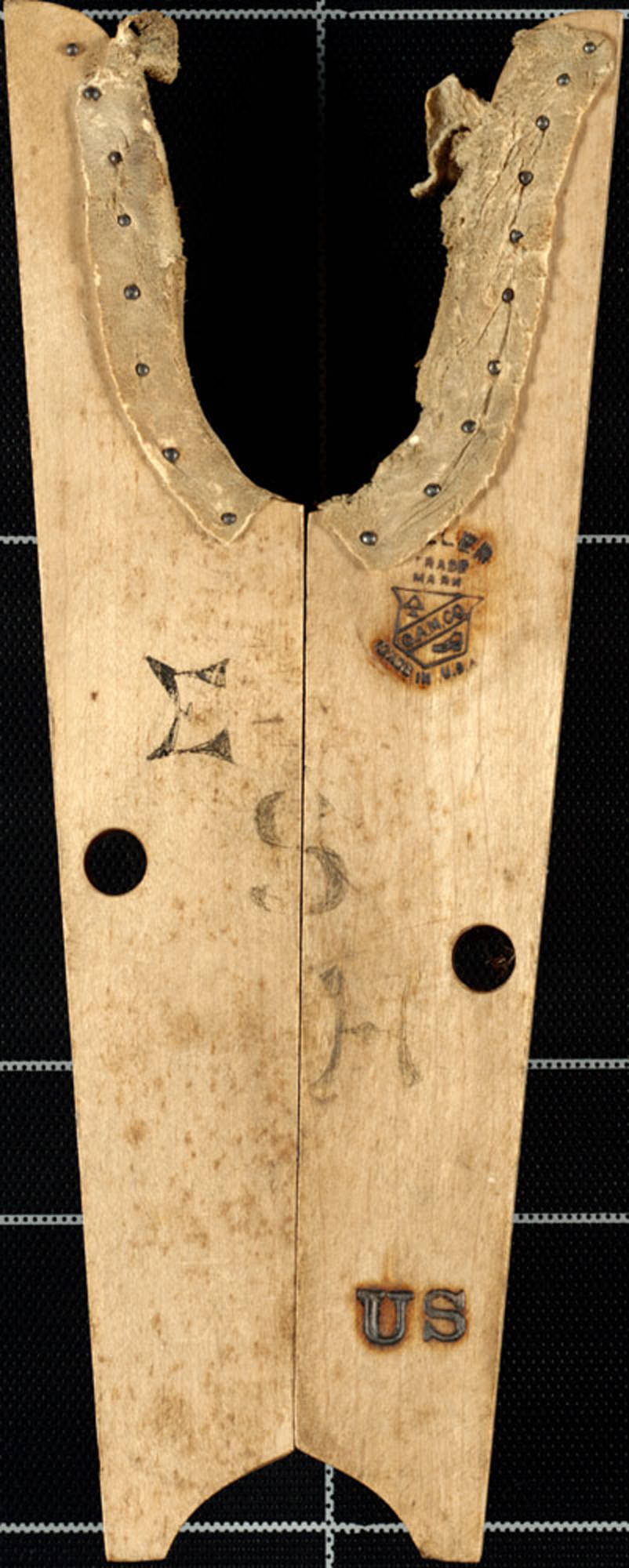 Boot jacks are used for removing boots. The heel of the boot was placed in the curved (U shaped) end.
