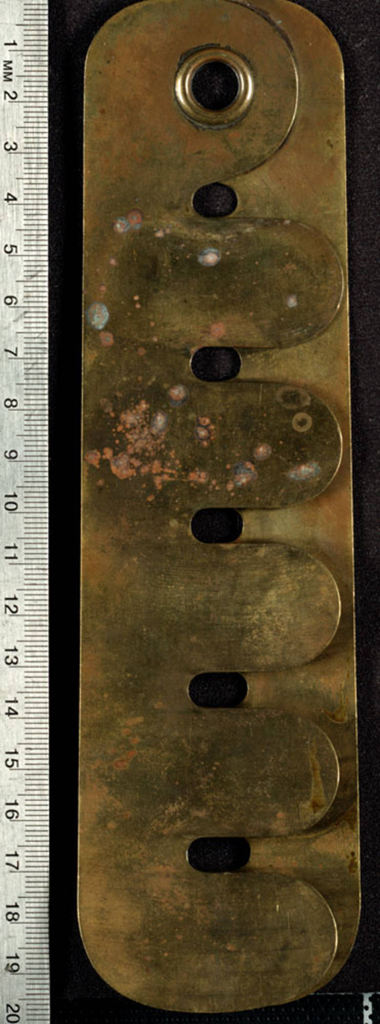 Button stick, also known as a button brass or button cleaning guard, is made of dull, discolored brass.