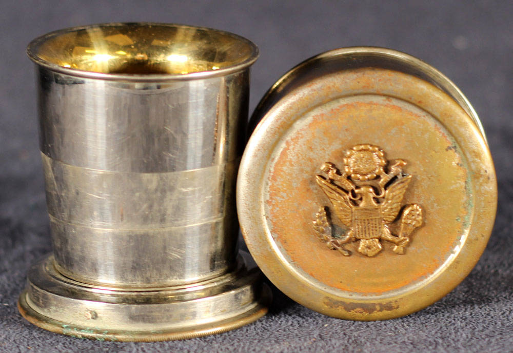 Collapsible drinking cup with U.S. Seal.