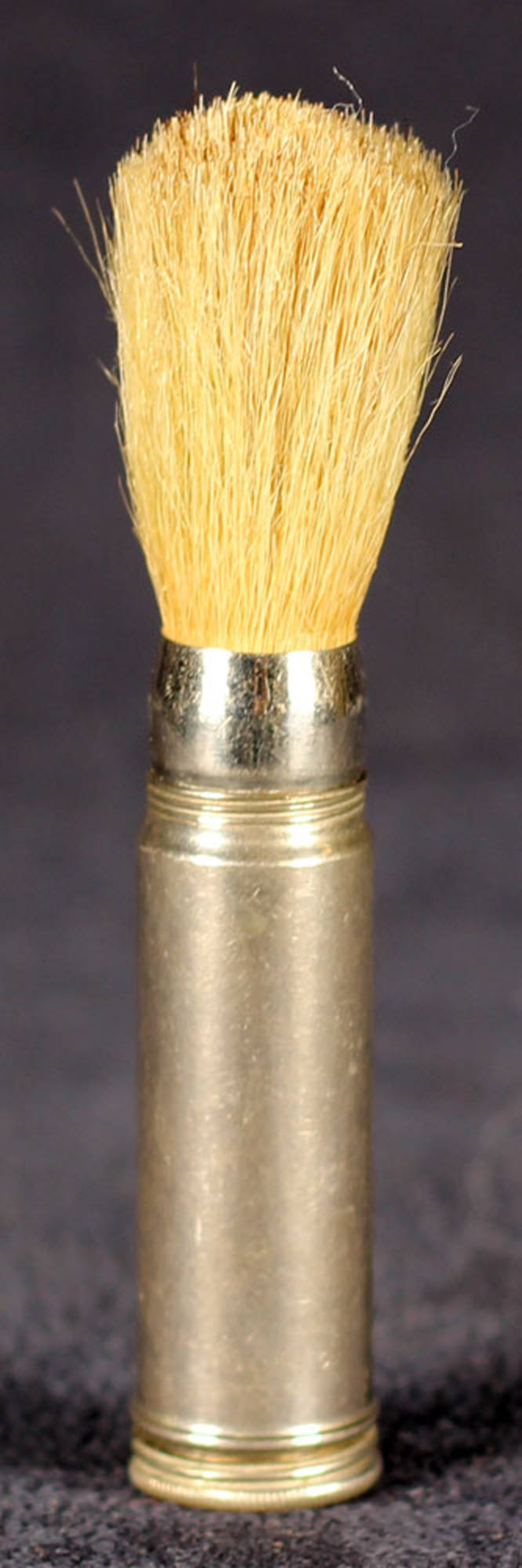 Metal shaving brush with screw-on handle.