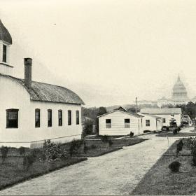 Photograph of a hospital complex with the capital building in the background.