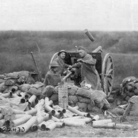 Soldiers firing a French 75mm howizer. 