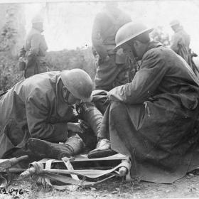 Members of Ambulance Company #12 administering first aid. 