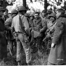 28th Division band and Quartermaster Company regroup in Bastogne.