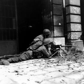 Machine gun crew fighting in the streets of Aachen, Germany.