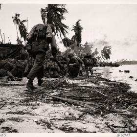 Marines land on Guam under enemy fire.