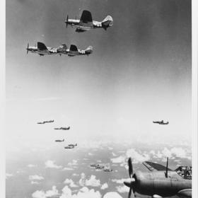 Squadron of Curtiss SB2C Helldivers intercept Japanese attackers. 
