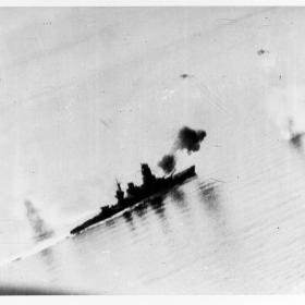 Aerial photo of Japanese Battleship Nagato firing