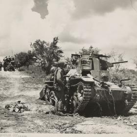 U.S. troops on Tinian advance towards the enemy. 