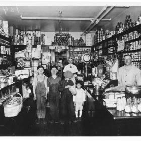 Joseph Levine and his sons in his store