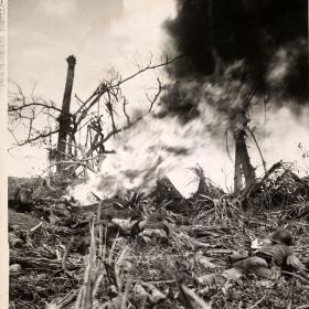 Marines use flamethrowers on pillboxes and other defensive positions on Guam.
