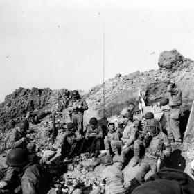 U.S. Army Rangers rest atop the cliffs at Pointe du Hoc, which they stormed in support of Omaha Beach landings on D-Day, 6 June 1944.