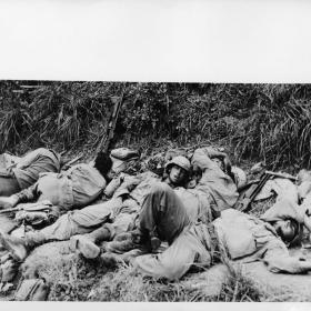 Exhausted soldiers sleep after combat on Okinawa.