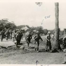 US soldiers leading Japanese soldiers to surrender.
