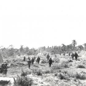 American troops moving inland on Luzon, Philippines.