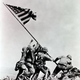 American flag being raised on Iwo Jima.