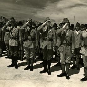 Japanese naval officers salute during surrender.