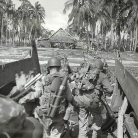 The first wave of American troops on the island of Leyte.  