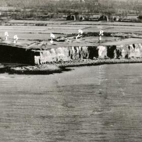 Allied commanders utilized annotated reconnaissance photos to determine the positions of German artillery at Pointe du Hoc.