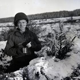 Ssgt O'Brien standing in a foxhole in Monschau, Germany.